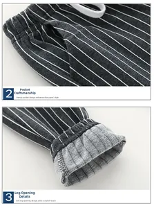 Detail view of boys vertical striped trousers showing pocket craft and ribbed cuffs