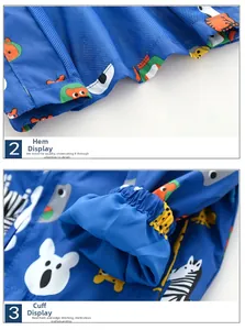 Detail of blue cartoon animal kids windbreaker with mesh lining and elastic cuffs