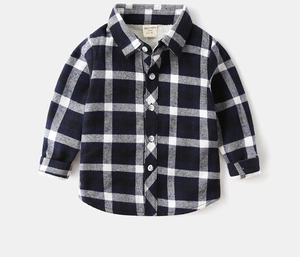 Detail of boys' winter plaid shirt with thick fleece lining and warm soft fabric