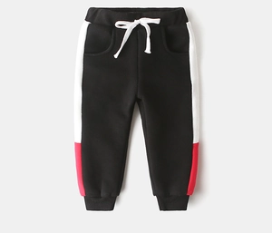 Detail of boys fleece joggers featuring contrast side stripes and drawstring waistband
