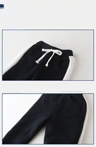 Detail view of boys' winter fleece joggers featuring elastic waist and white drawstrings