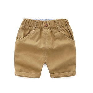 Classic khaki children shorts featuring elastic waistband and decorative amber button