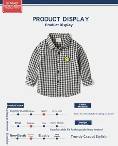 Close-up of cotton long sleeve kids shirt with black and white gingham and yellow smiley patch