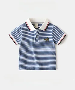 Detail of boys' striped cotton polo shirt featuring blue white stripes and airplane embroidery