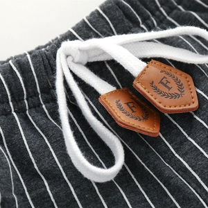 Kids grey striped casual trousers with elastic waistband and decorative drawstring