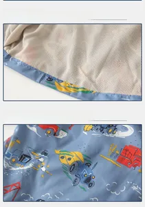 Detail view of cartoon tractor prints and breathable mesh lining on toddler jacket