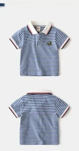 Close-up of striped boys polo shirt featuring white collar and airplane embroidery detail