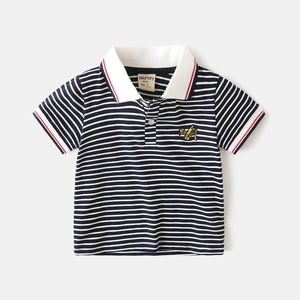 Detail of baby boys' navy striped polo shirt featuring yellow airplane embroidery