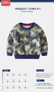 Detail of boys' dinosaur print sweatshirt fabric showing cotton blend material and texture