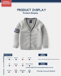 Detail of grey V-neck cardigan featuring penguin embroidery and navy striped cuffs