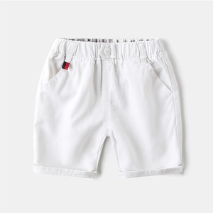 Classic white cotton shorts for boys with elastic waist and stylish tricolor label