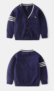 Detail view of navy blue kids cardigan with white stripes and bird crown embroidery