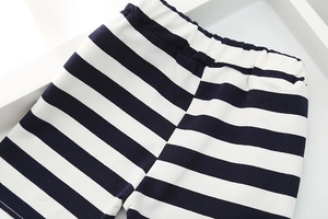 Close-up of boys' black and white striped cotton shorts featuring an elastic waistband