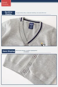 Detail of grey knitted kids cardigan with crown embroidery and navy striped V-neckline