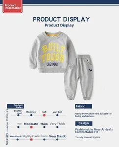 Detail of grey cotton sports set for boys with 'Built Tough Like Daddy' print and logo