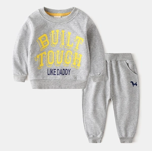 Macro detail of kids gray sports set showing BUILT TOUGH print and soft fabric texture