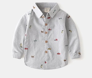 Detail of toddler long sleeve shirt featuring colorful car and animal embroidery