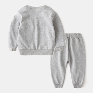 Detail view of grey cotton-blend sweatshirt and joggers with ribbed cuffs and hem