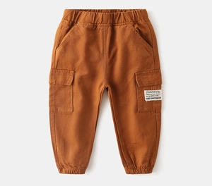 Detailed view of caramel brown kids cargo pants with elastic waist and side pocket label