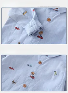 Detail view of boys light blue oxford shirt with car and animal cartoon prints