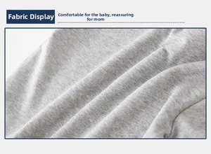 Detailed fabric texture of the light gray knitted cotton baby tracksuit