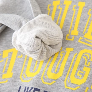 Grey boys' sweatshirt with yellow 'GET TOUGH' print showing soft french terry fabric
