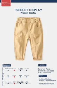 Detail view of khaki cotton boy trousers showing elastic waist and soft twill fabric texture