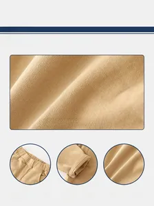 Detail of boys' khaki casual pants showing twill cotton fabric and elastic waistband
