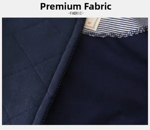 Macro detail of navy quilted baseball jacket featuring zipper and diamond texture fabric
