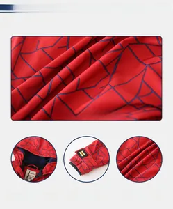 Detail of red boys winter jacket showing stand collar, elastic cuffs and inner logo tag