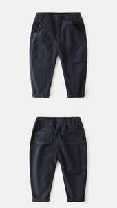 Detail of navy cotton boy pants showing elastic waist and practical four-pocket design