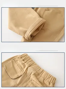 Detail of khaki cotton boys' pants showing the elastic waist and stitched hemline