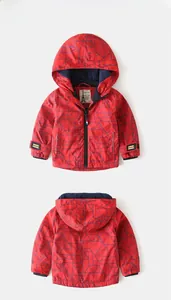 Detailed front and back view of red hooded kids jacket with blue geometric patterns