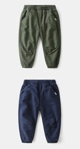 Detail of army green and navy blue kids' padded joggers with elastic waist and ribbed cuffs