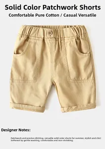 Detail of khaki cotton kids shorts featuring elastic waistband and workwear style pockets