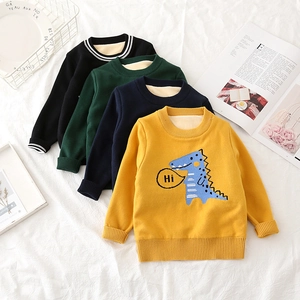 Close-up of thick fleece lining and colorful dinosaur knit patterns on children sweaters