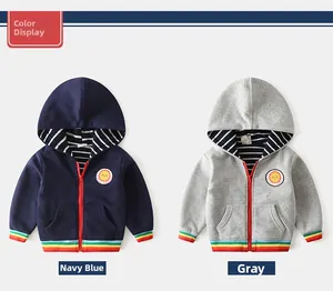 Detail of boys zip-up hoodies in navy and grey with rainbow striped cuffs and sun patch