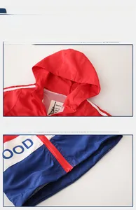 Detail of kids hooded jacket with breathable mesh lining and contrast color stitching