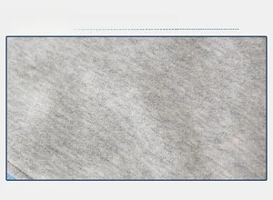 Close-up of light gray knit fabric showing soft cotton texture for boys hoodie