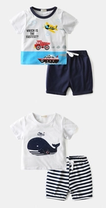 Detail of soft cotton kids summer sets with colorful cartoon prints and striped shorts