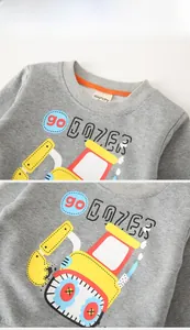Detail of gray kids sweatshirt showing rib knit collar and excavator print textures