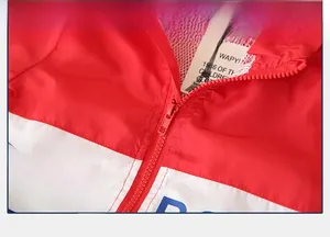 Detail of child sports jacket zipper with mesh lining and stylish color blocking
