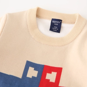 Kids beige crewneck sweater with blue and red car pattern and ribbed neck detail