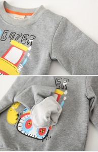 Detail of grey crewneck sweatshirt showing soft terry fabric and dozer print