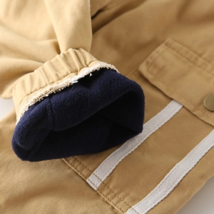 Kids winter cargo pants in khaki with thick blue fleece lining and elastic cuffs