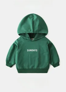Detailed view of kids' green hoodie showing 95% cotton fabric and SUNDAYS lettering