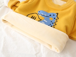 Kids warm fleece-lined knit sweater with blue dinosaur design and ginger yellow fabric