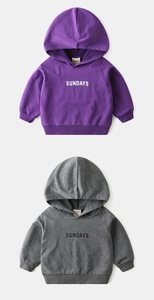 Detail of purple and grey hoodies showing cotton texture, hood, and woven size 90 label