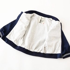 Kids navy baseball jacket with windproof fabric, grey cotton lining and striped cuffs