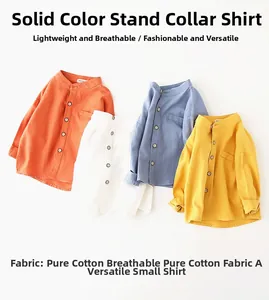 Detail of four colorful long-sleeve cotton shirts with stand collar for boys